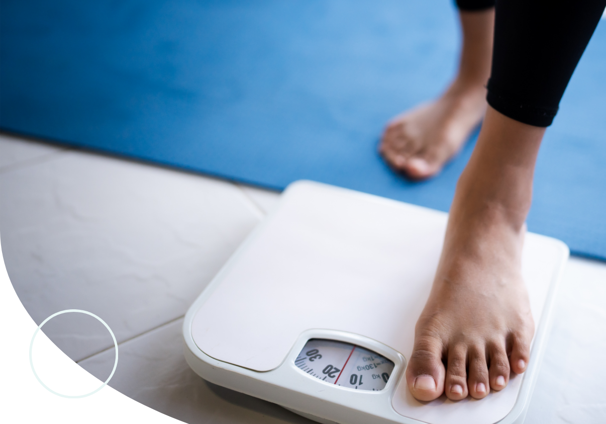 person stepping on scale