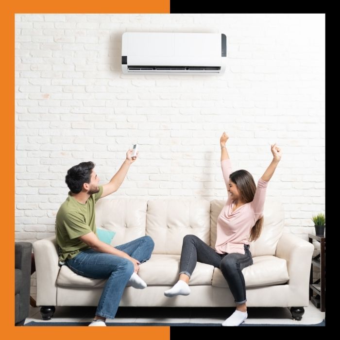 couple enjoying mini-split AC unit