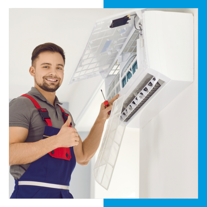 man installing mini split