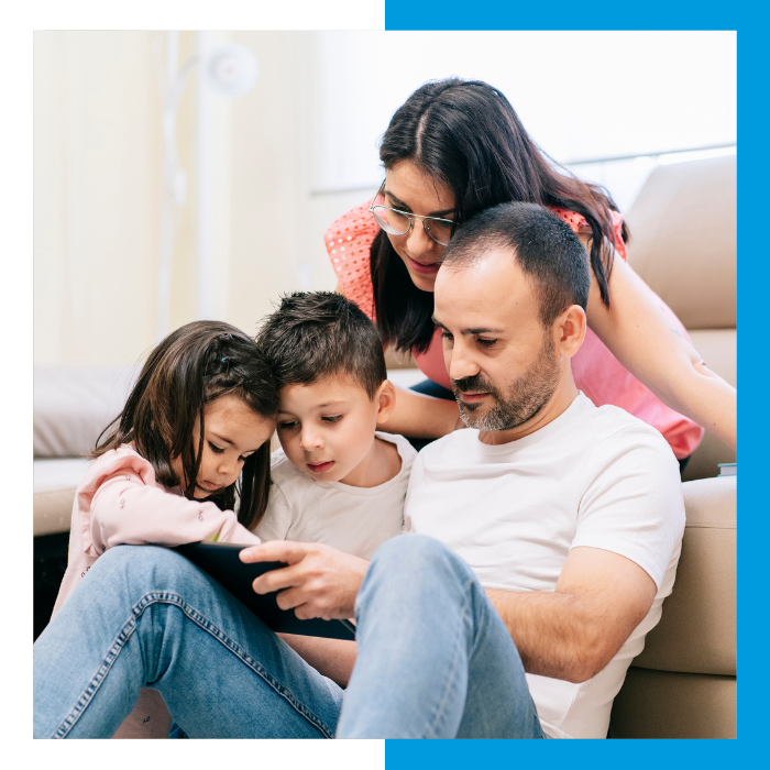 family comfortable in living room