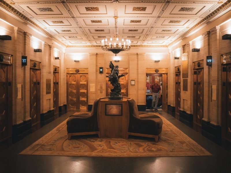 inteior of a well lit hotel elevator room