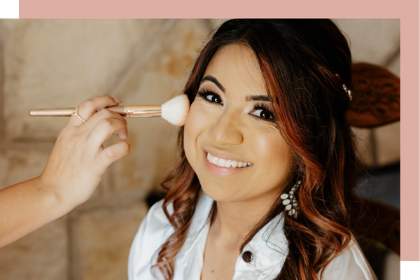 A bride getting her makeup professionally done A bride getting her makeup professionally done