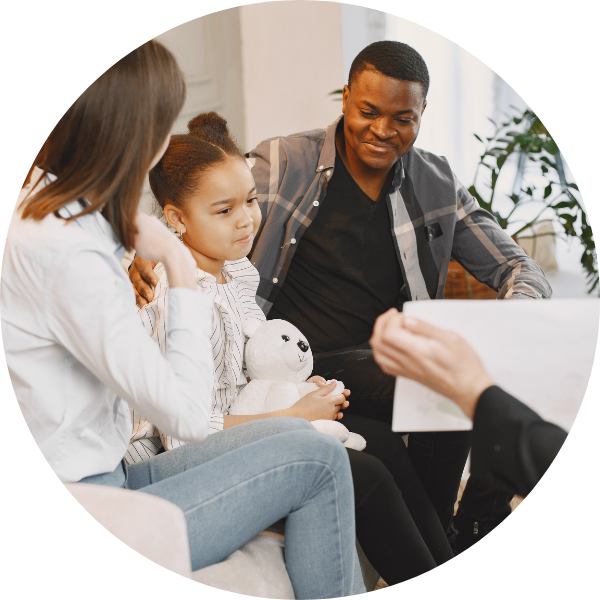 family in a session together with therapist