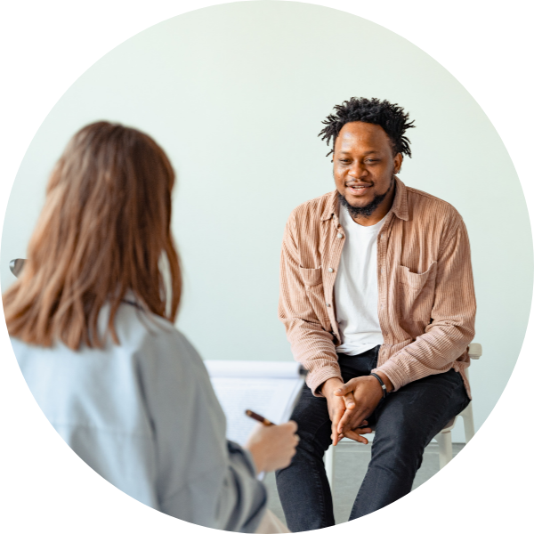 man in a therapy session with a couselor