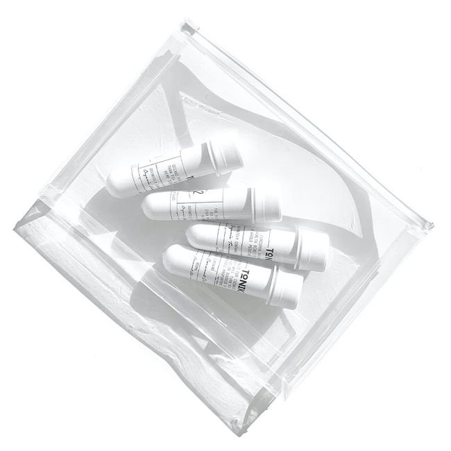 a clear box with makeup tubes inside