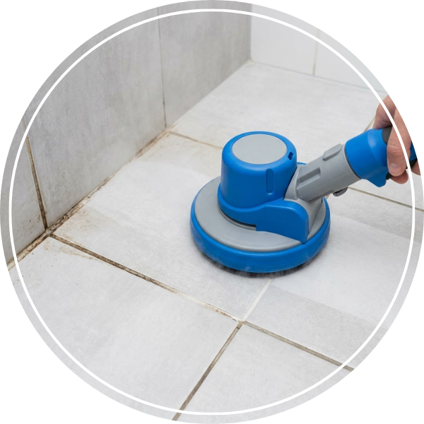 A floor buffer being used to clean the tile and grout in a shower