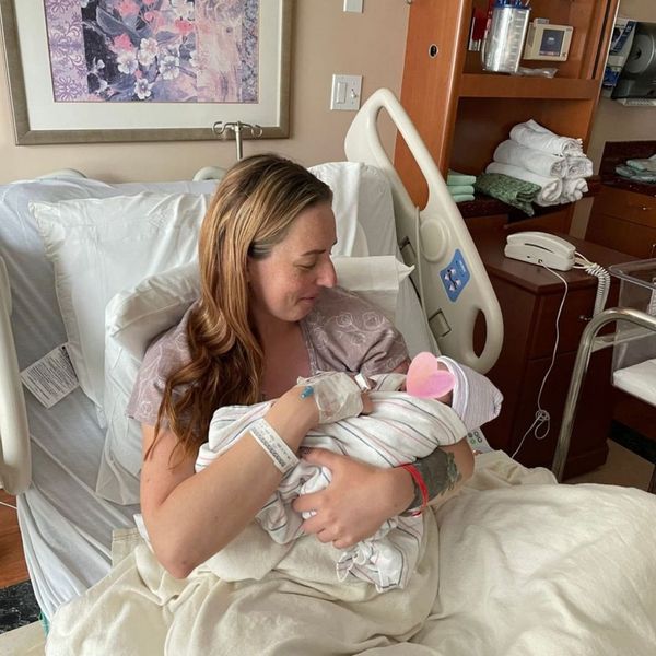 A woman holding a new baby