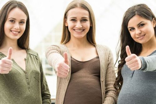 three pregnant woman giving thumbs up Become A Surrogate.jpg