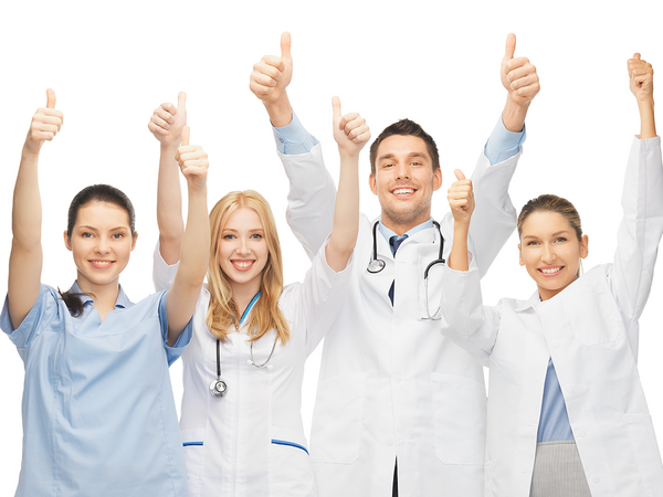 A group of doctors putting two thumbs up in the air and smiling.