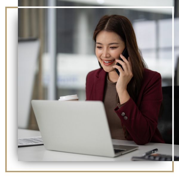 Business professional on the phone with a consultant.