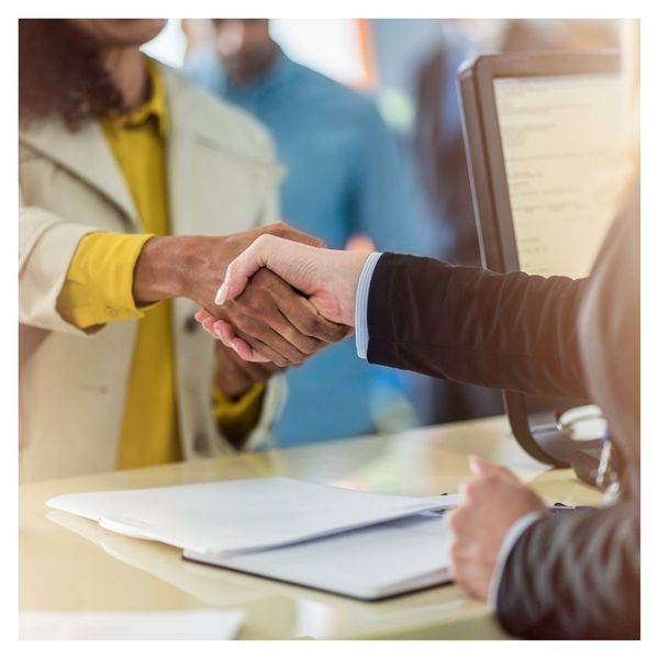 customer and employee shaking hands