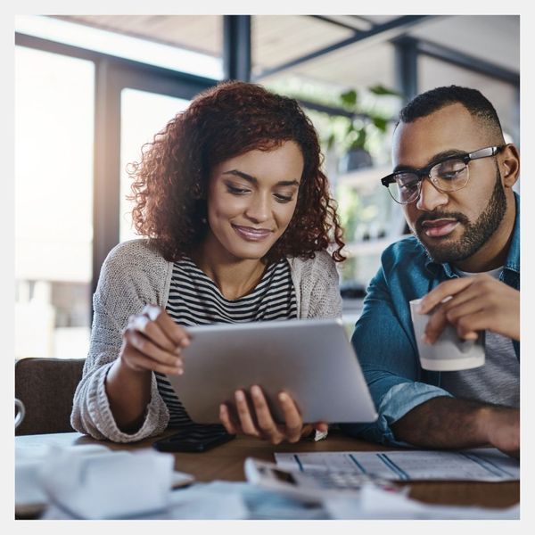 couple looking at tablet