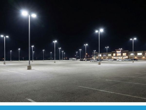 Empty parking lot with light poles