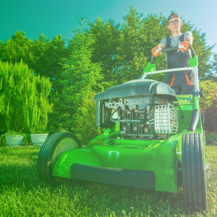 landscaper mowing landscaper mowing