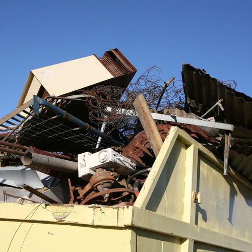 dumpster with old junk