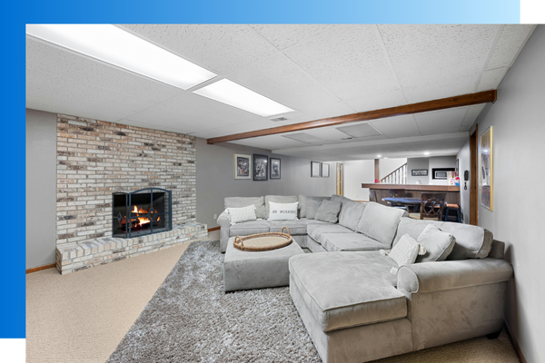 remodeled basement with large grey couch