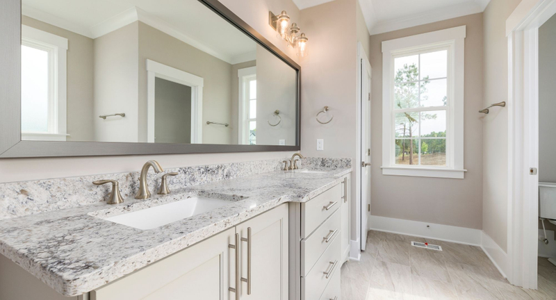 beige-white bathroom with granite countertop
