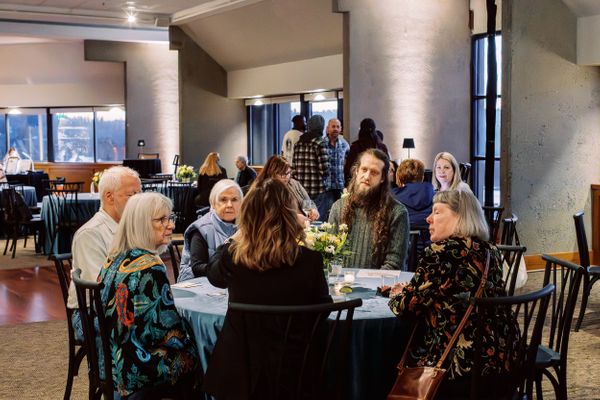 Guests at an event in Oregon City discussing Venue Two Eleven