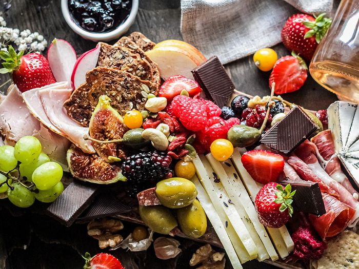 A charcuterie board with berries 