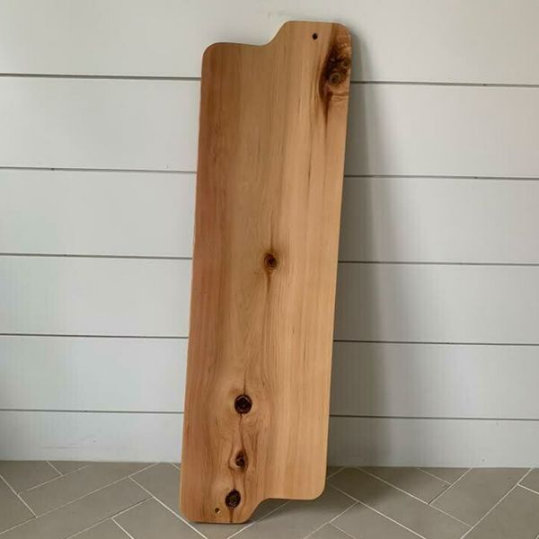 A long, wooden, custom bathtub board. A long, wooden, custom bathtub board.