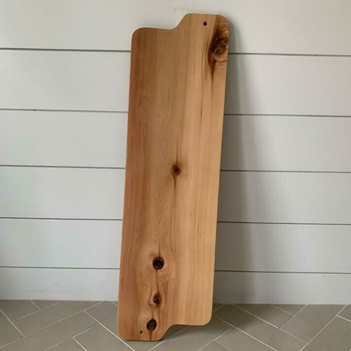 A long, wooden, custom bathtub board.