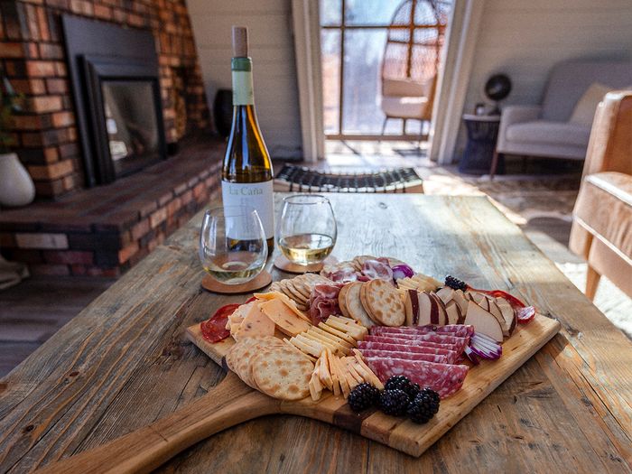 A spread of food on a charcuterie board.