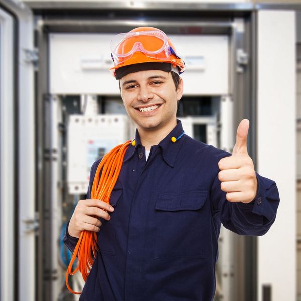 smiling electrician with thumbs up