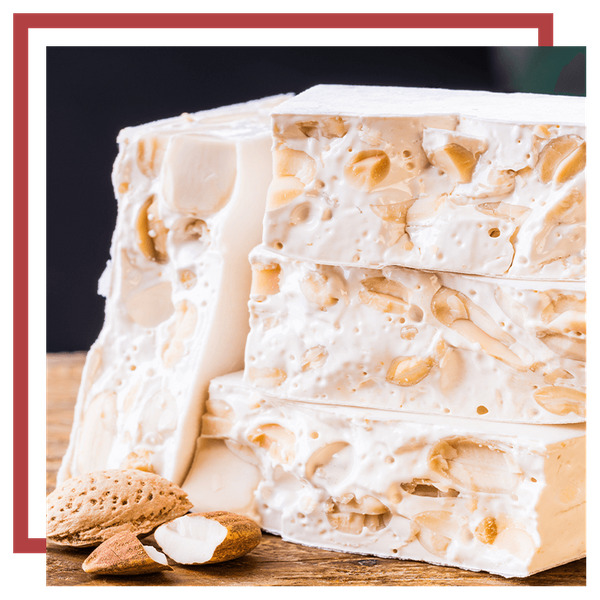 An image of white nougat bars with almonds