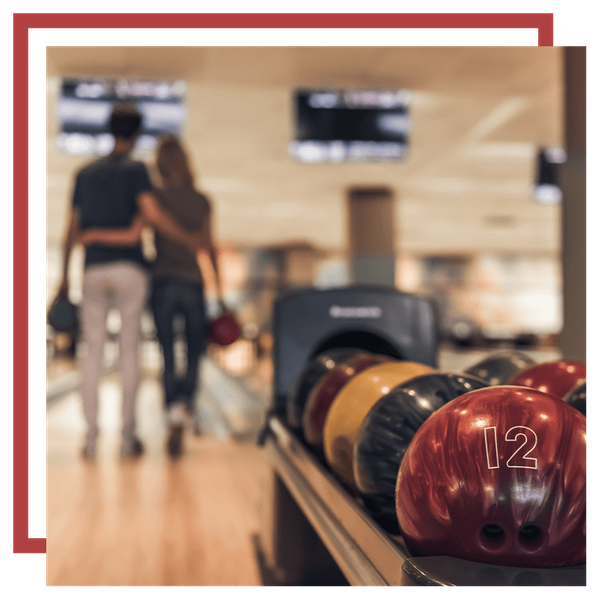 Image of two people on a date at a bowling alley