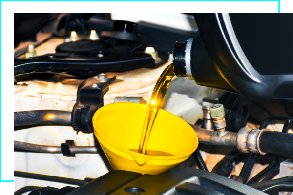 Engine oil pouring to yellow funnel , new engine oil change