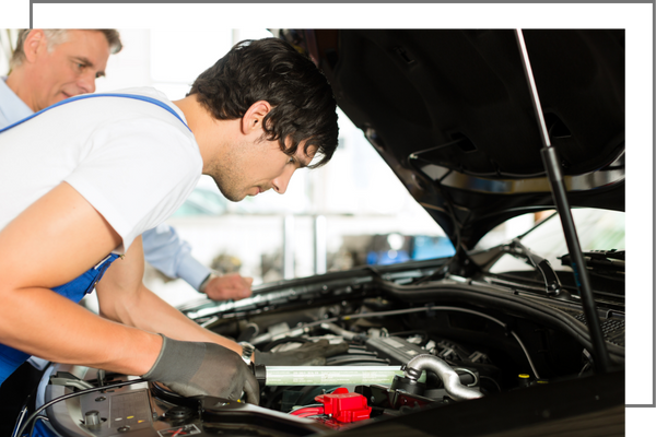 mechanic working on a car. 