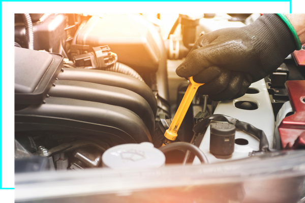 mechanic grabbing dipstick