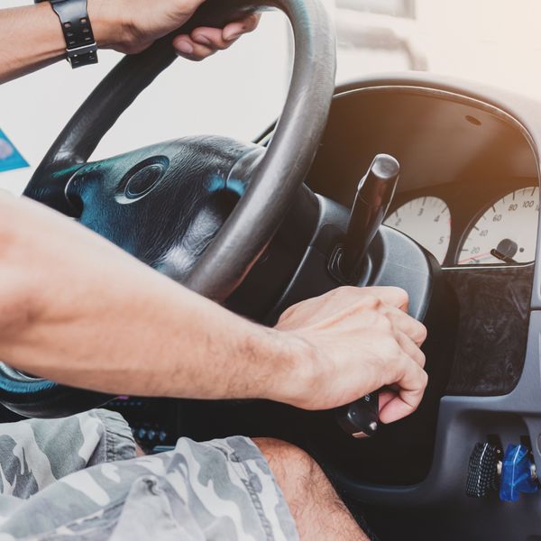 man trying to start a car