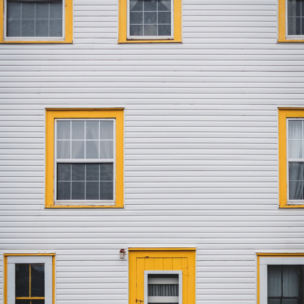 house with yellow accents around windows