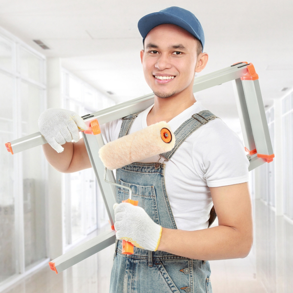 painter holding ladder and roller