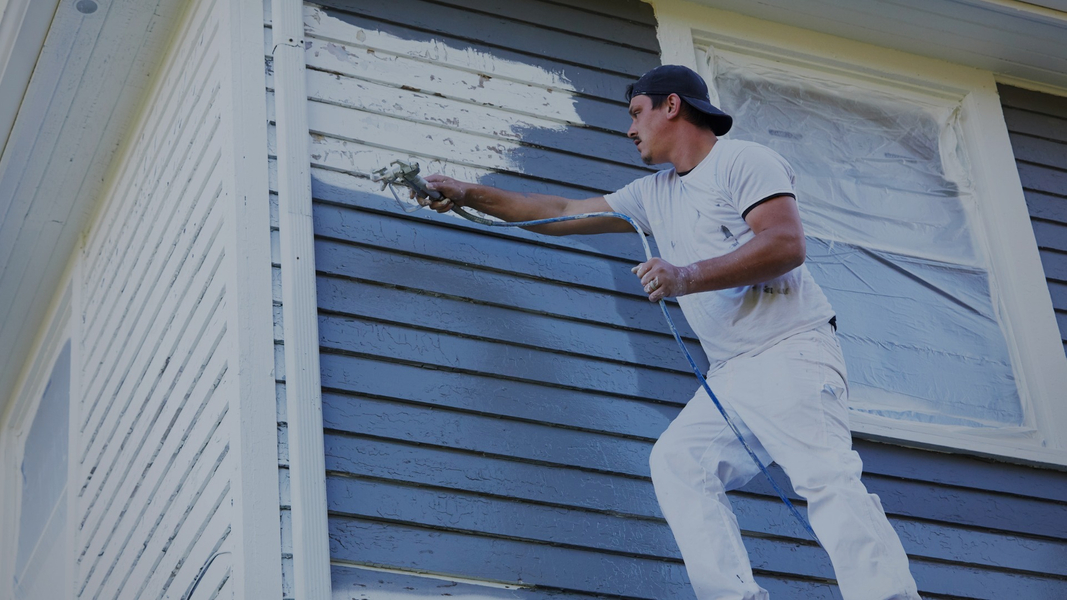 house with old paint being repainted