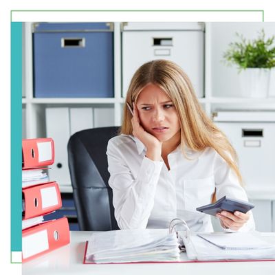 Woman stressing with her stack of binders