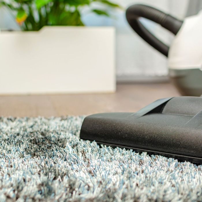 a stained carpet being cleaned