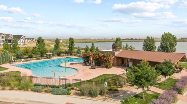 The Lakes at Centerra in Loveland, CO, is a beautiful neighborhood located near Highway 34 and I-25, with easy access to Denver International Airport. Close to Mountain View High School and Front Range Community College, it offers parks like Centerra Park and Boyd Lake. Nearby Chapungu Sculpture Park, Loveland Museum, and local government offices provide cultural attractions. The Lakes at Centerra, Loveland, CO