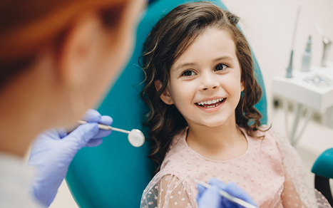 Image of a kid getting a dental exam