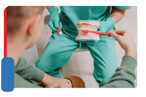 dentist demonstrating proper brushing