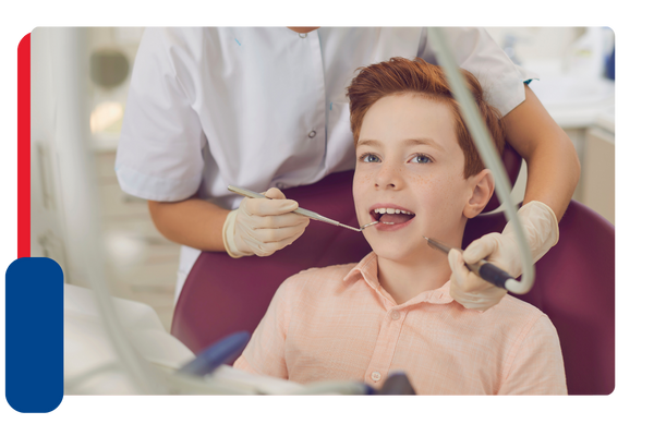 A young child having his teeth inspected by a dentist
