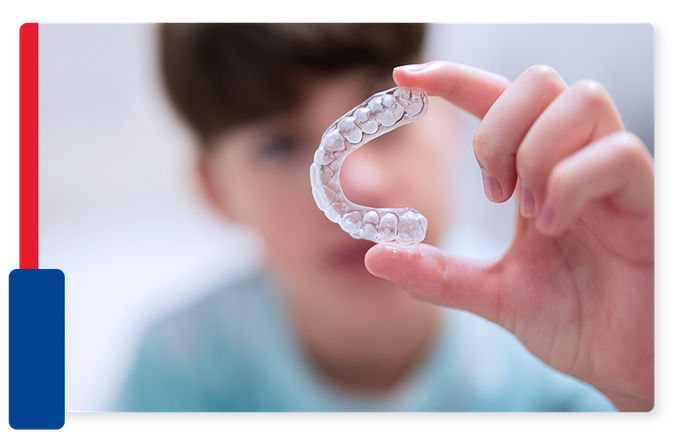 image of a kid holding Invisalign