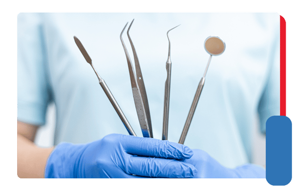 dentist holding dental tools