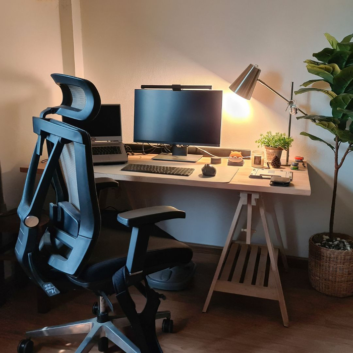 A home office with an ergonomic office chair