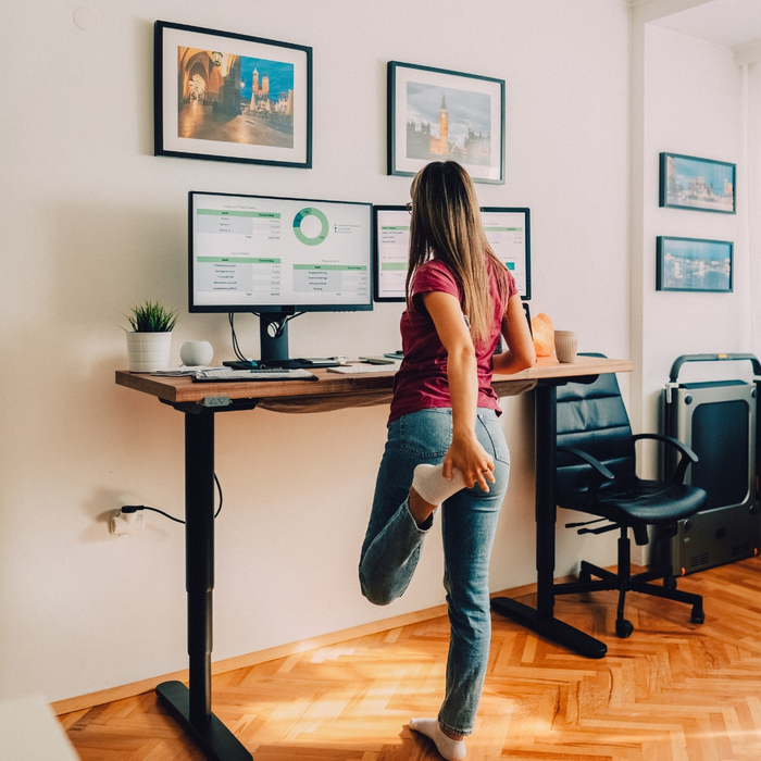 woman standing at standing desk