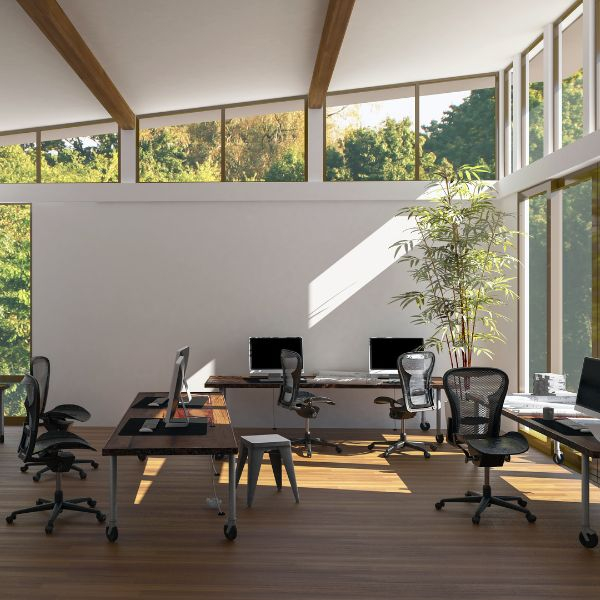 An office space with multple desks and chairs