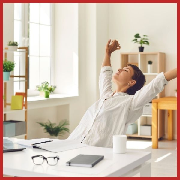 Person happy sitting at their office desk