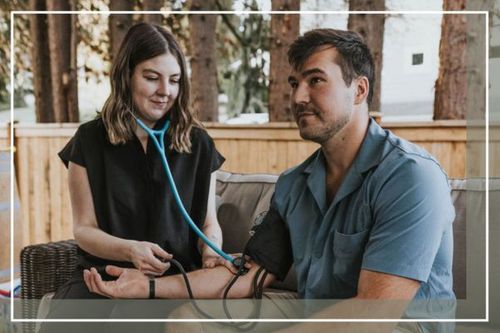 nurse taking a man's blood pressure