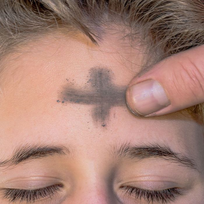 sign of the cross drawn on forehead with ashes